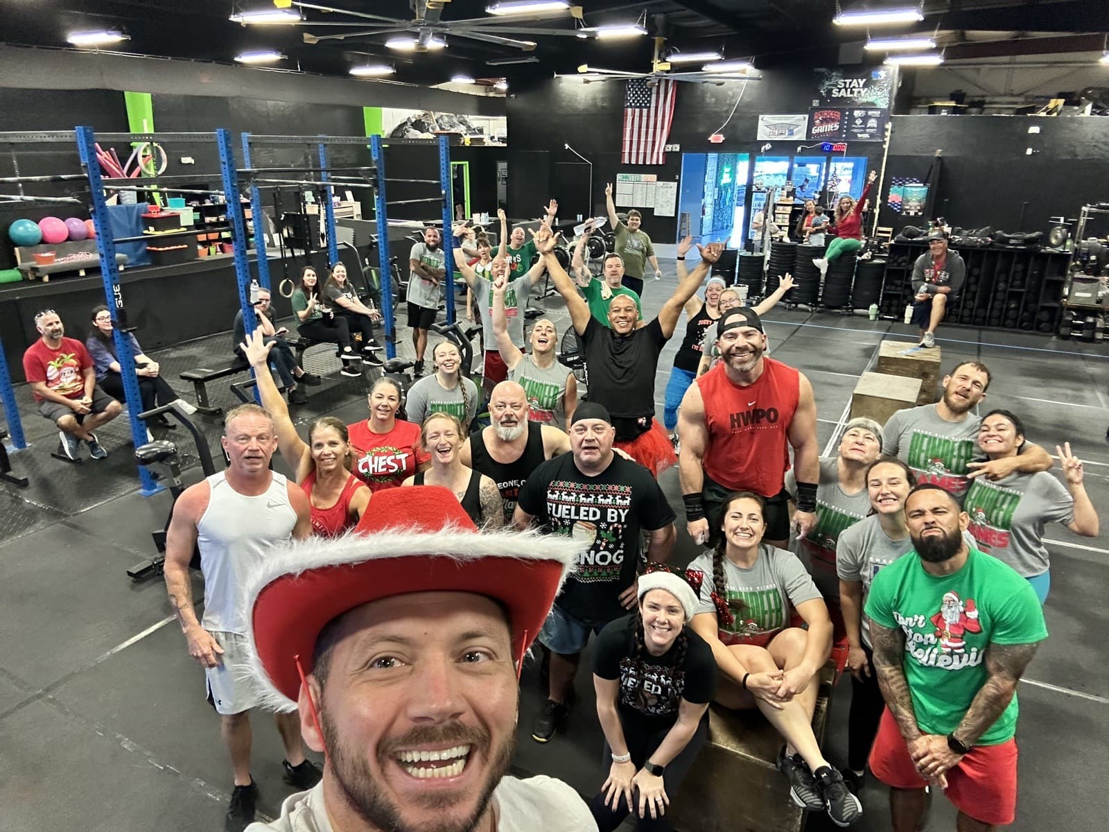 A group of Shark Bite Fitness members together on the gym floor